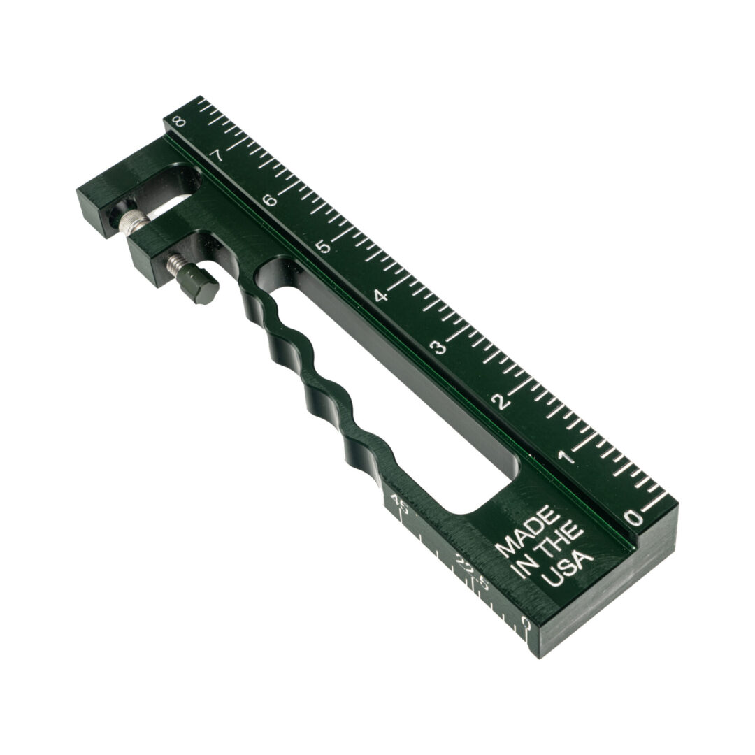 A green metal ruler with a twist of the end.